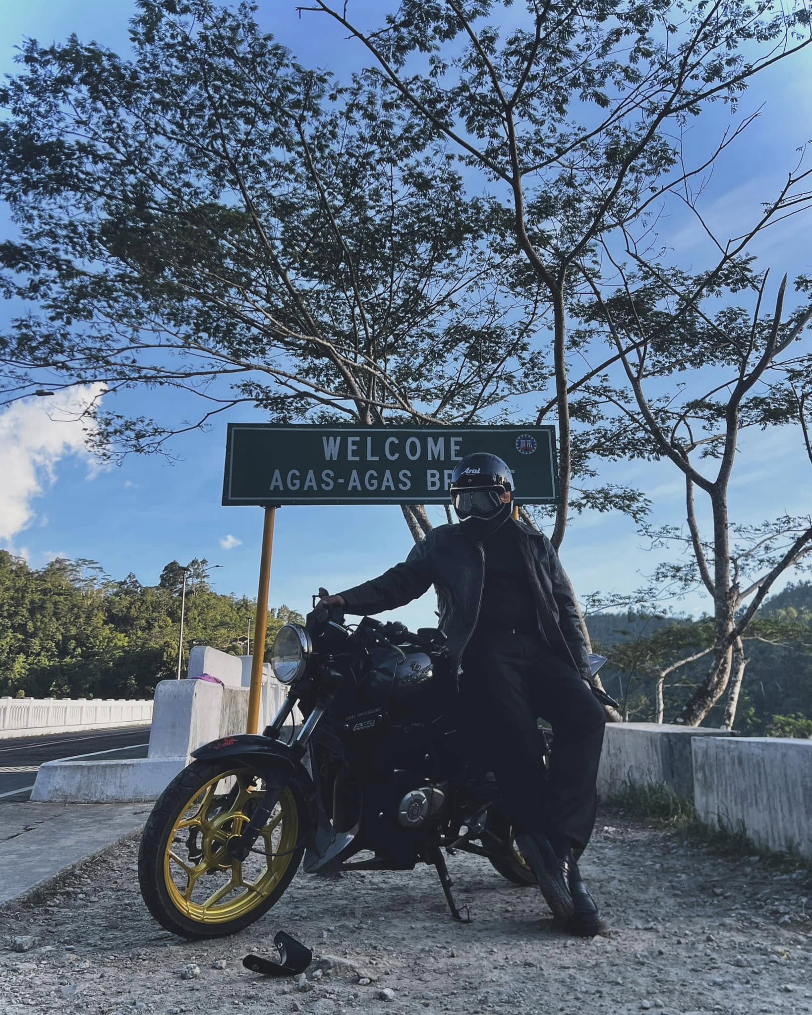 Emir Casil Cortez beside a motorcycle at Agas-Agas Bridge